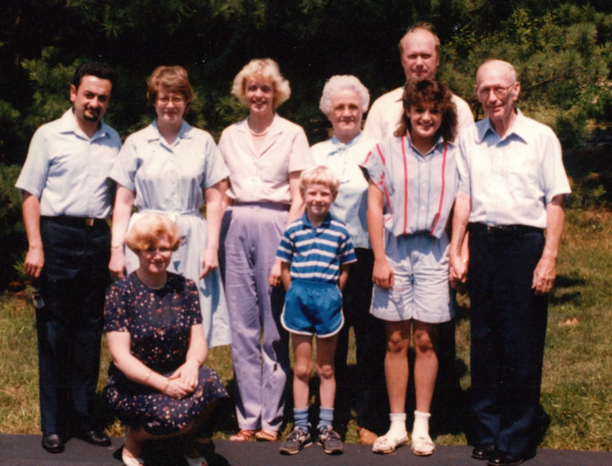 Extended Eesley family gathering outdoors with Will and Peggy and young Chuck — c. 1985–1986