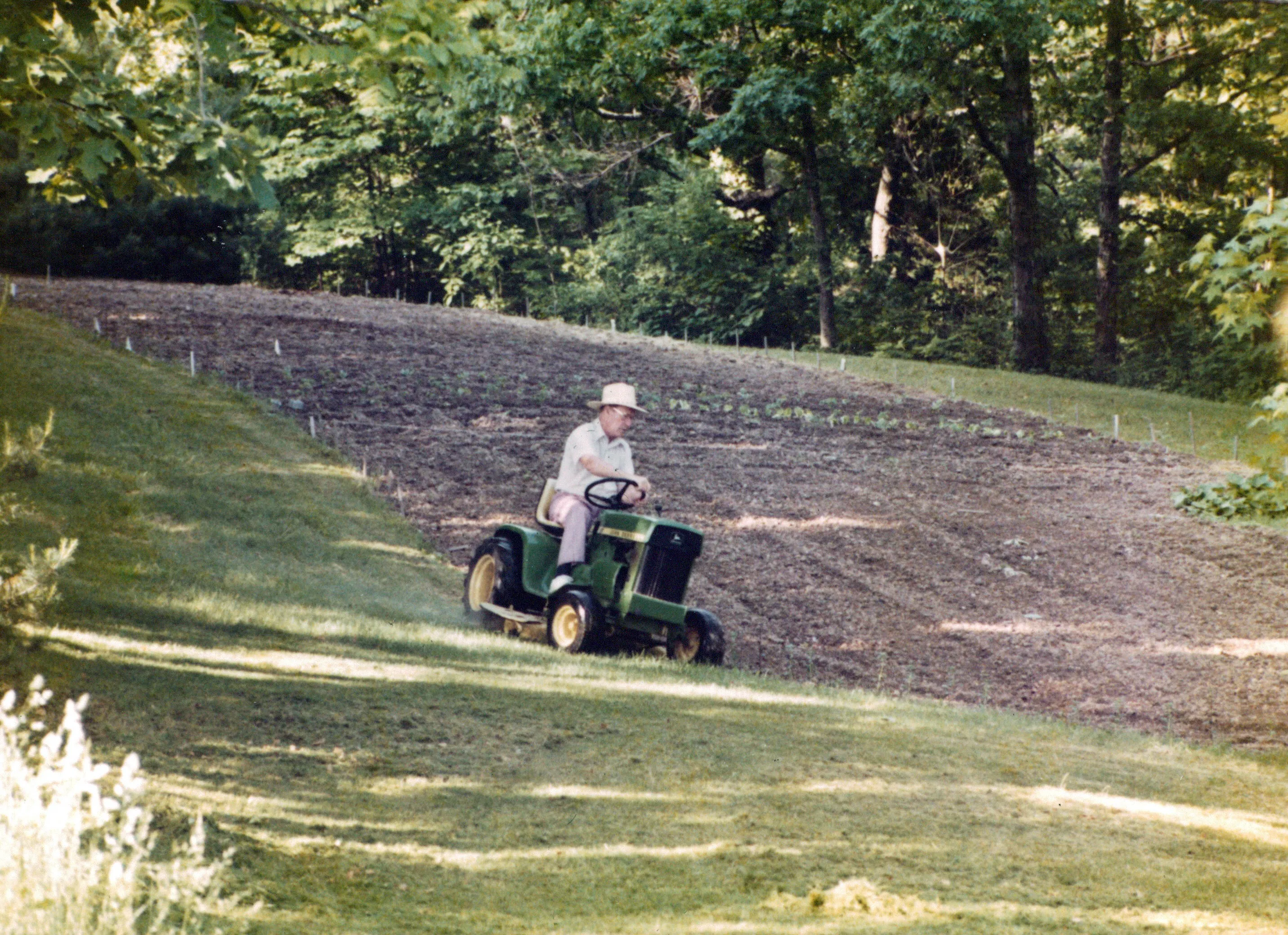 Will Eesley on the John Deere, the Highland Ridge property, c. 1970s