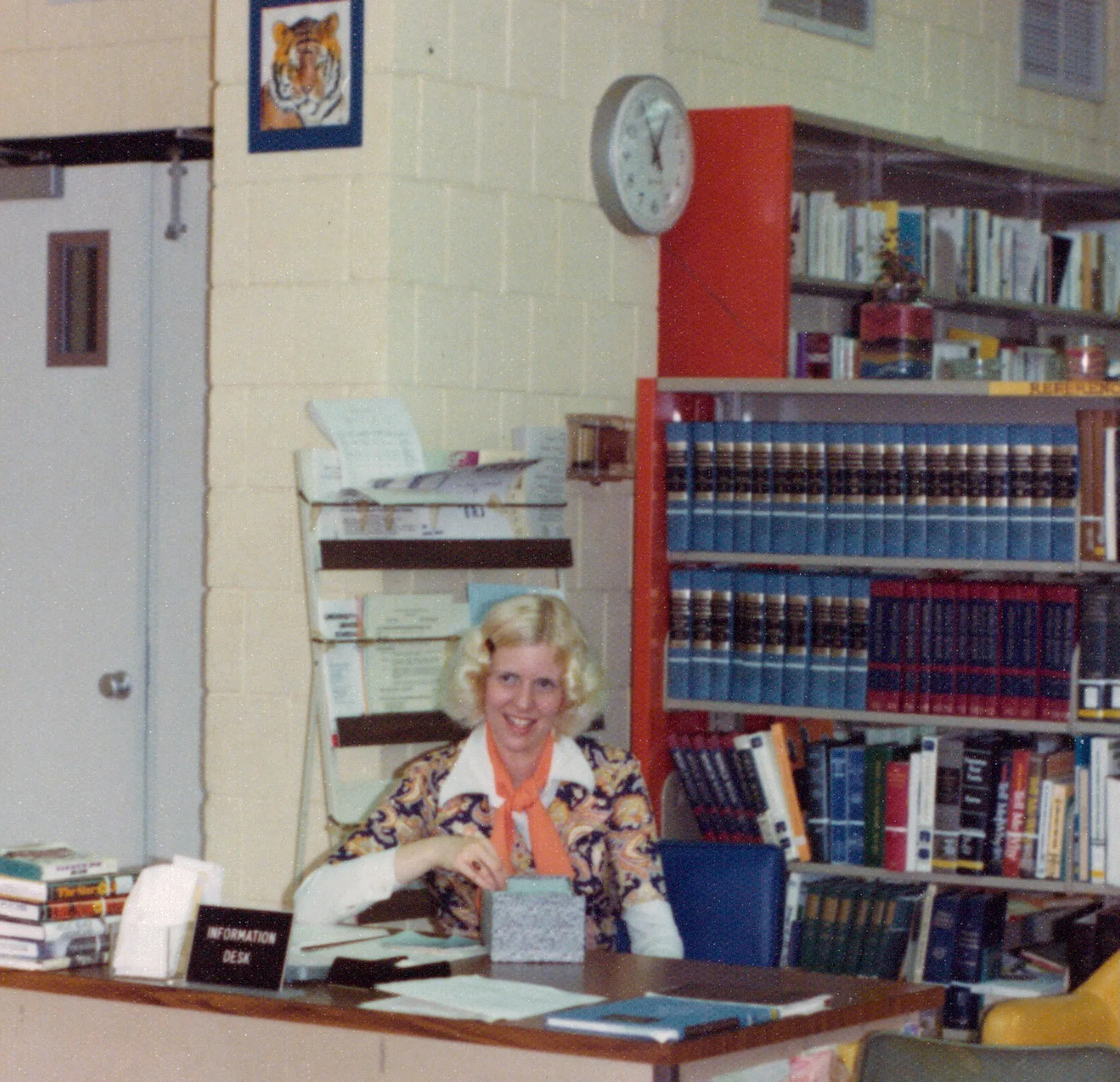 Terrie at the library information desk, c. 1970s