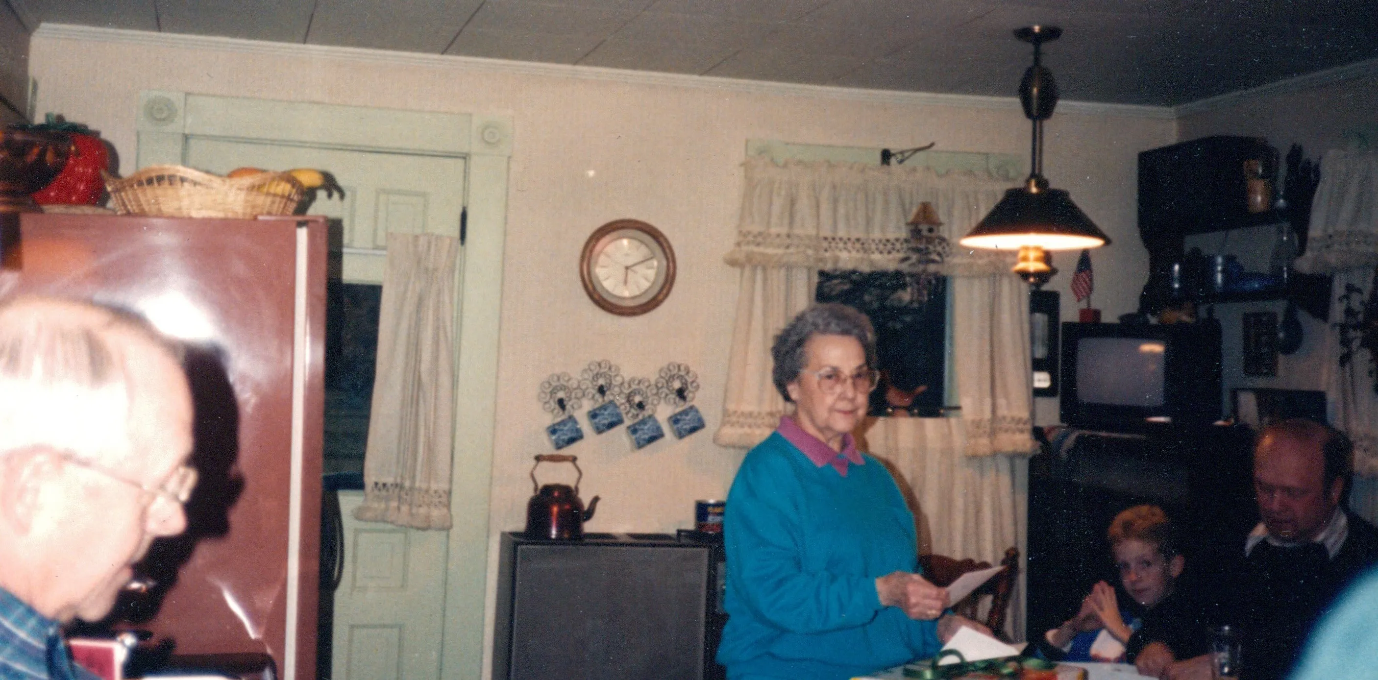 Faye Angel at her house with young Chuck in the background and Charlie — c. 1990s