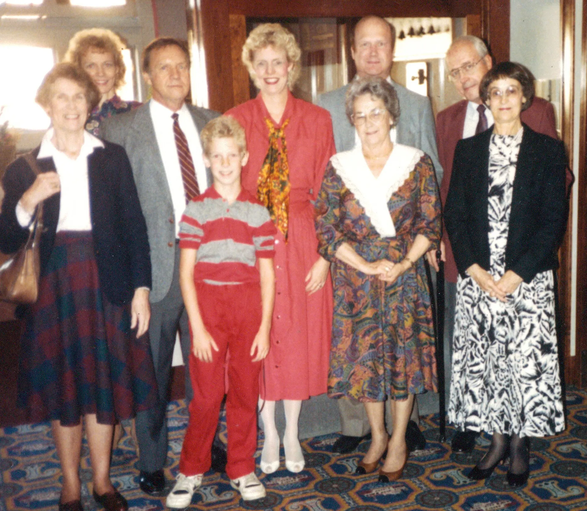 Family group of eight at the Lafayette Hotel restaurant, Marietta — c. 1985–1990 (cast queued)