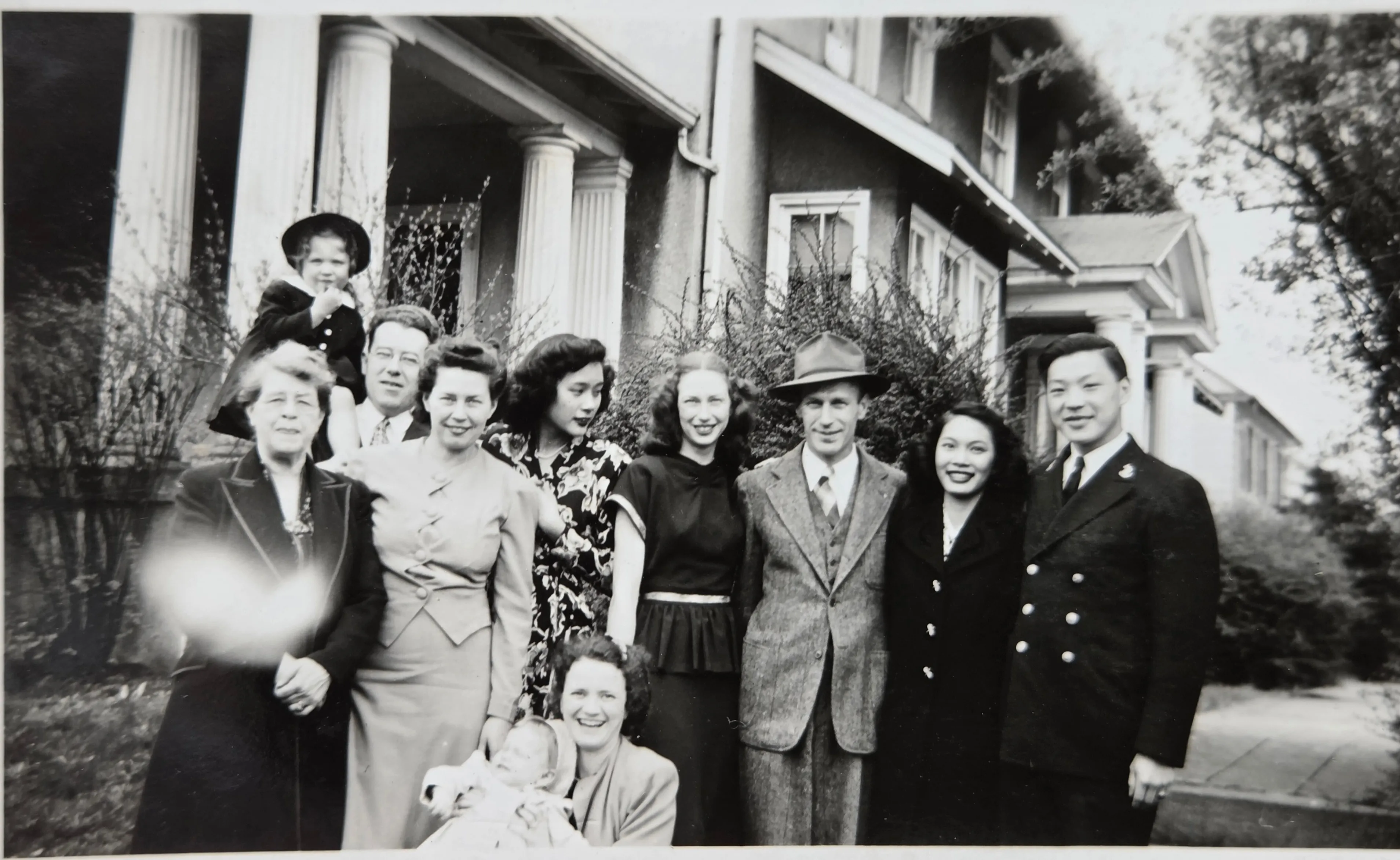Stella and Ted Chong wedding day — nine on the Cassady Avenue porch, c. April 1945