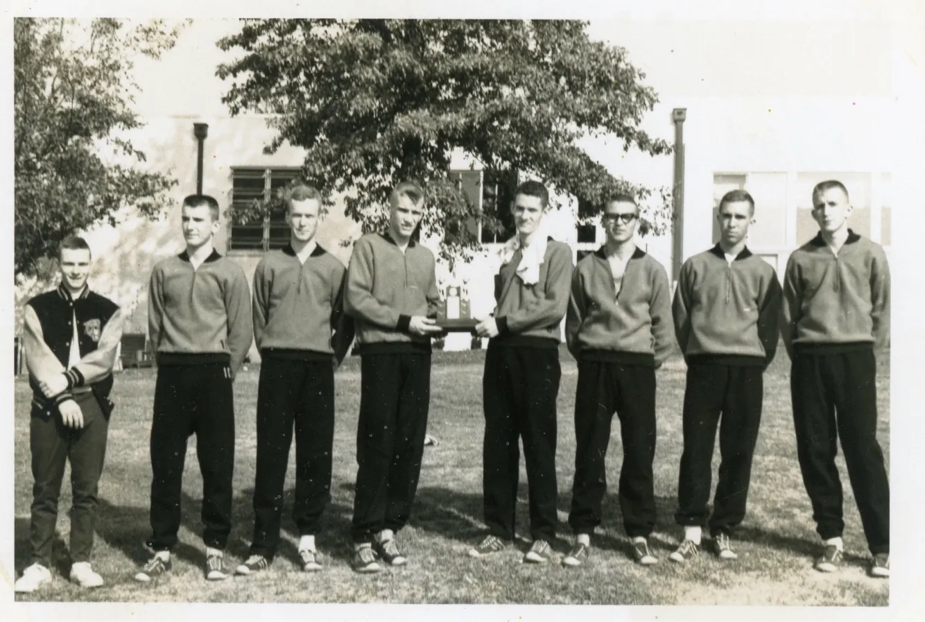 Marietta High School cross country team holding their plaque — c. 1963–1965, with Charlie Eesley