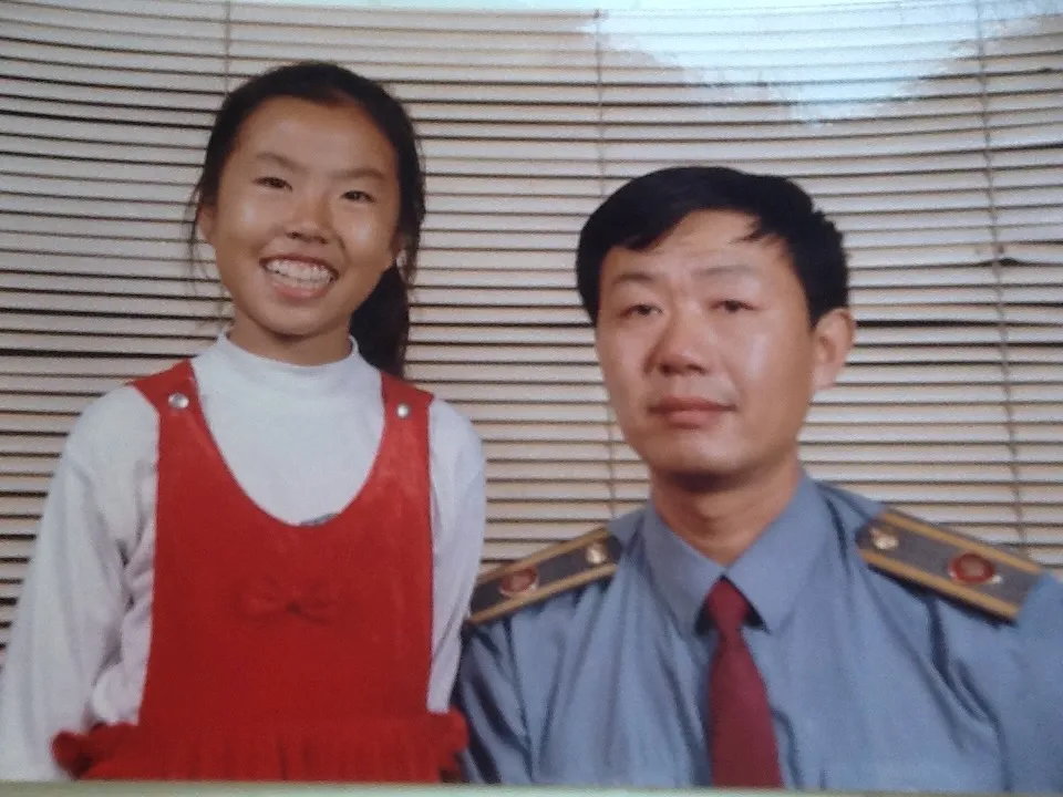 Ling Zhou with teenage Lijie, c. 1990s (still from home-video footage)