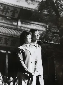 The same temple gate, three frames — Ling & Xun 1982, Ling & Xun 2019, Chuck & Lijie 2019<br /><span class='font-sans not-italic'>同一座山门，三帧合影 — 周玲与李恂 1982、周玲与李恂 2019、Chuck与Lijie 2019</span> — 1982