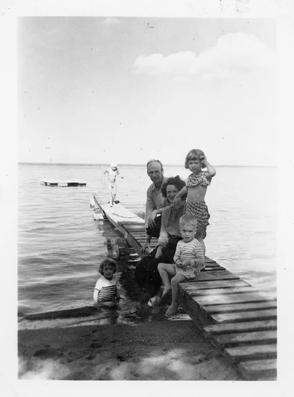 Will and Peggy Eesley with Charlie, Jeanne, and Anne on the Black Lake dock, c. 1950–1952