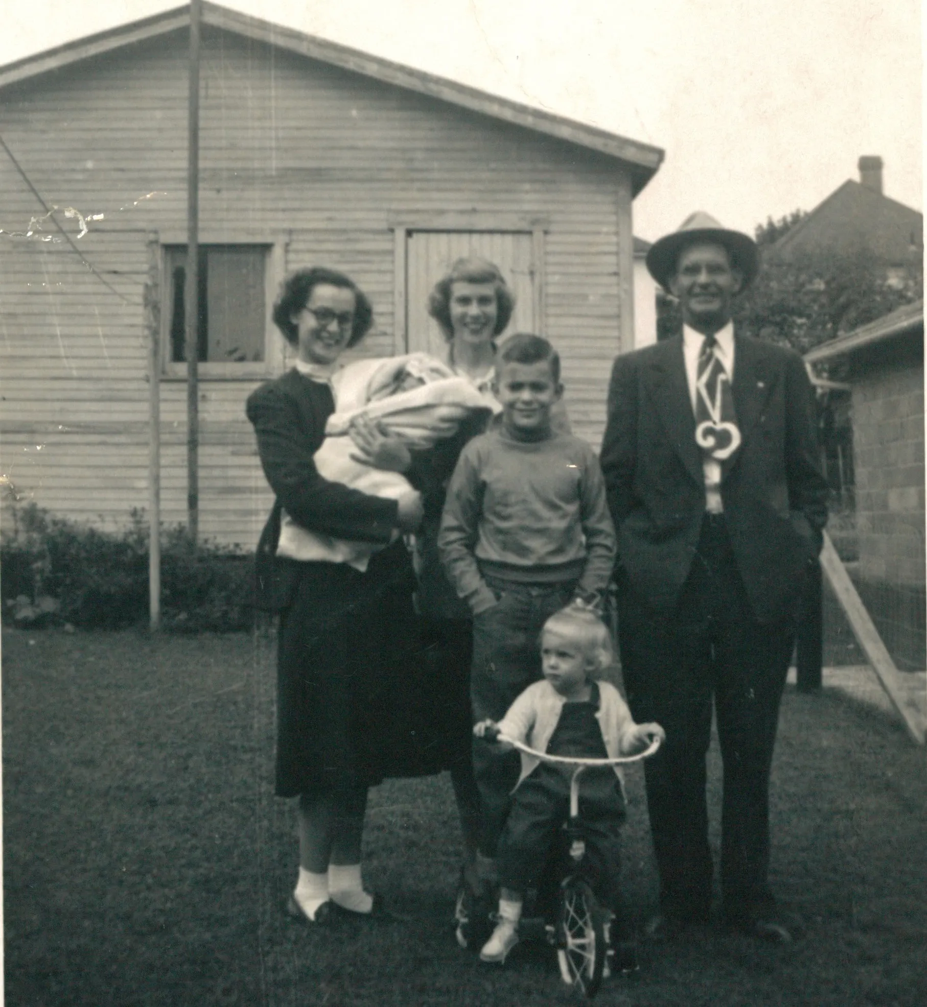 Homer Davis at right in fedora, with what appears to be one of his daughters' families — c. 1953-1955, ages of the children pointing to mid-1950s. From Chuck's keeping.