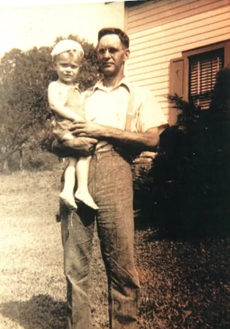 Homer Davis holding his son William Harvey Davis Sr. — c. 1943