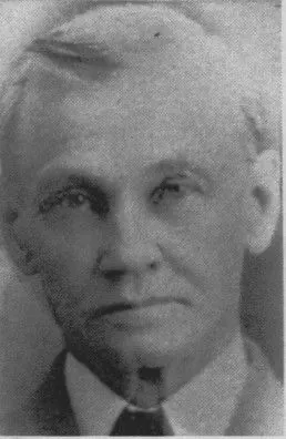 John Franklin Eesley as an older man, c. 1920s — a studio portrait of the Plainwell miller in his sixties: grey hair swept back, clean-shaven, in a dark suit and tie.