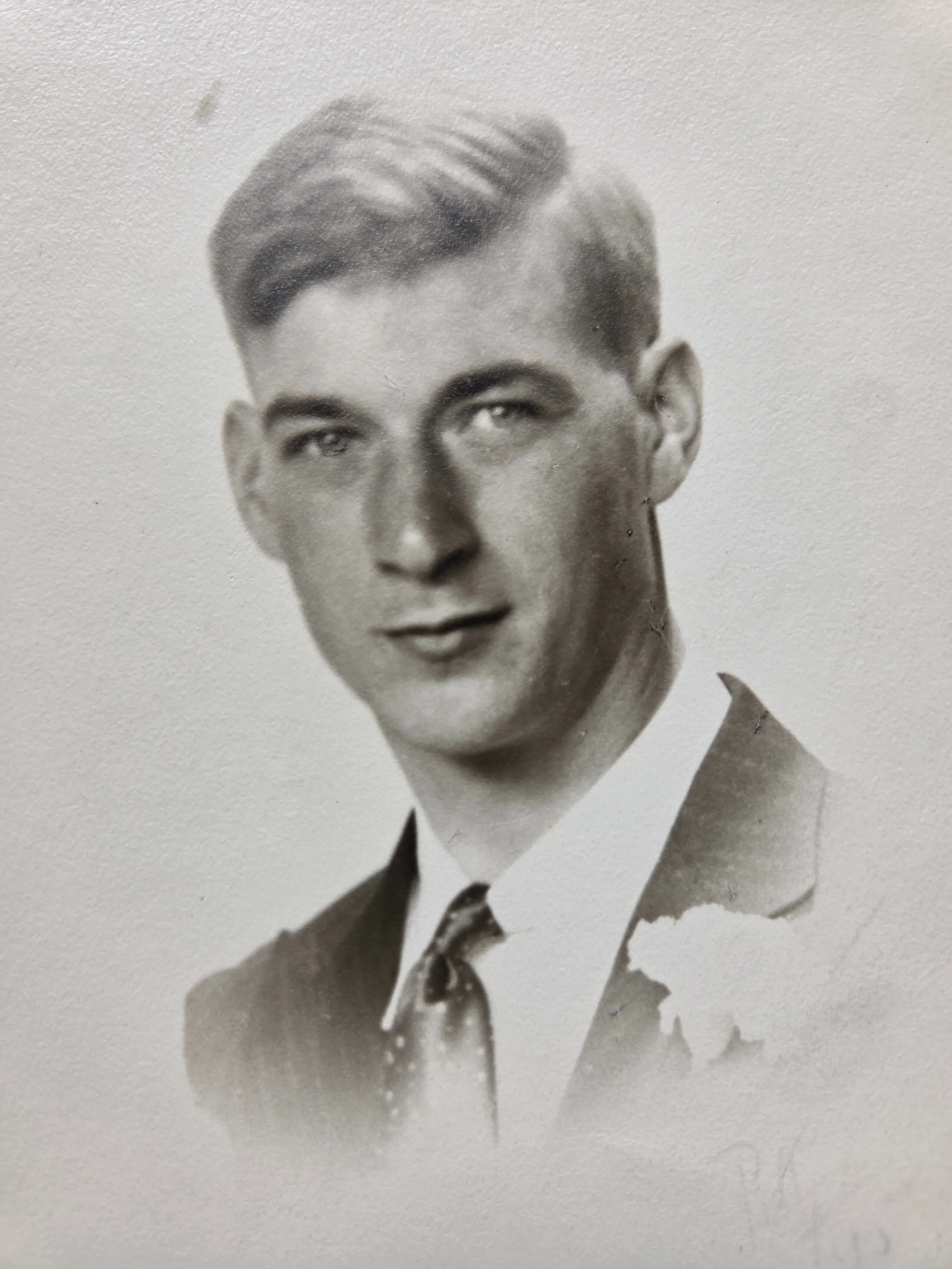 Lyle Eesley in suit, tie, and white boutonnière — a formal portrait that suggests a wedding, possibly his brother Leonard David's marriage to Helen Bernadine Alspach. c. mid-late 1930s. From Roberta Burnes's keeping via Helen Eesley Burnes.