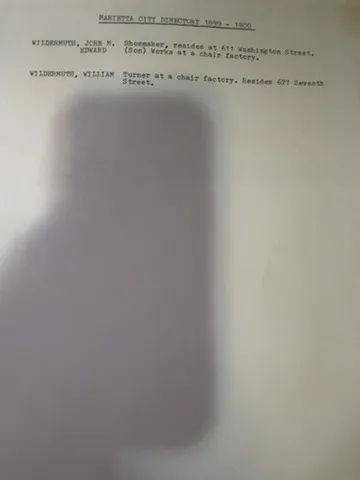 A typed extract from the Marietta City Directory 1899-1900 recording John M. Wildermuth, shoemaker, residing at 611 Washington Street; Edward, son, works at a chair factory; and William Wildermuth, turner at a chair factory, residing at 627 Seventh Street.