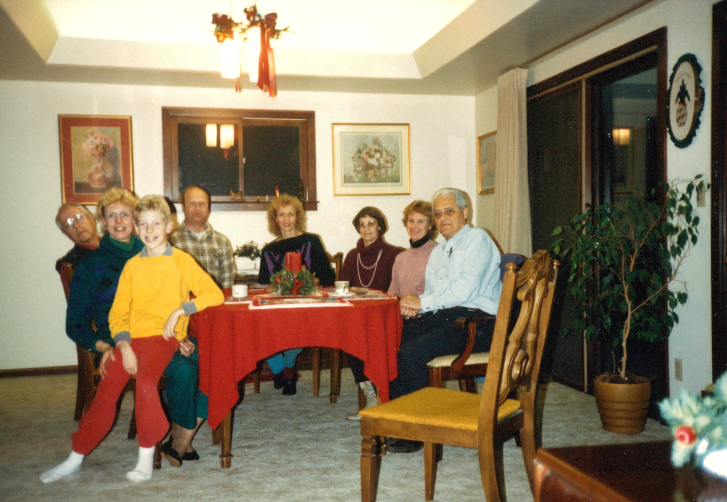 A family holiday dinner on Terrie Eesley's Wildermuth side, c. late 1980s — young Chuck with his parents Charlie and Terrie, Terrie's uncle Norman Wolfe, her sisters Sandy Wildermuth and Debbie Wildermuth Massaro, Betty (Davis) Wolfe, and Angelo Massaro. From Chuck's keeping.