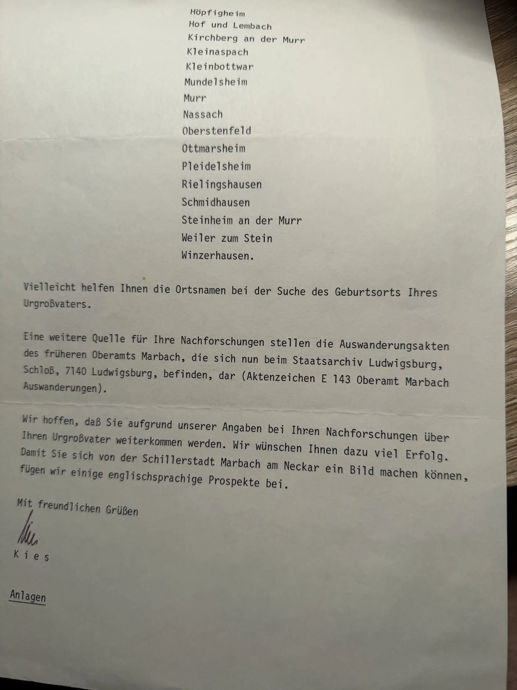 Page two of the Stadt Marbach letter, completing the list of villages and pointing Robert Earl to the emigration files of the former Oberamt Marbach now held at the Staatsarchiv Ludwigsburg under reference E 143 Oberamt Marbach Auswanderungen, with good wishes and enclosed English-language brochures about Marbach.