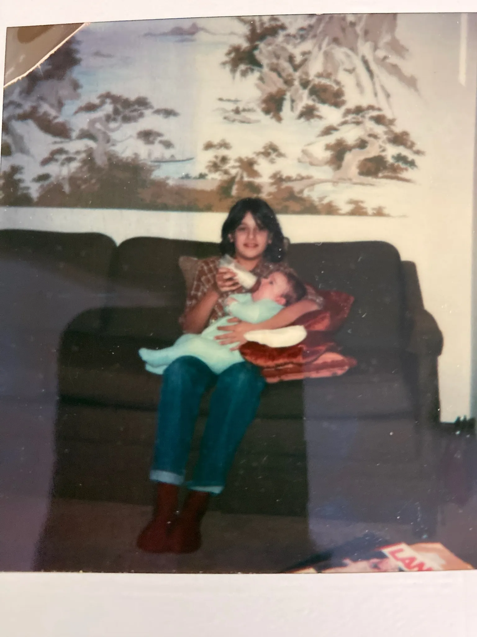 Stephanie Kamiab feeding baby Chuck at Highland Ridge, c. 1980