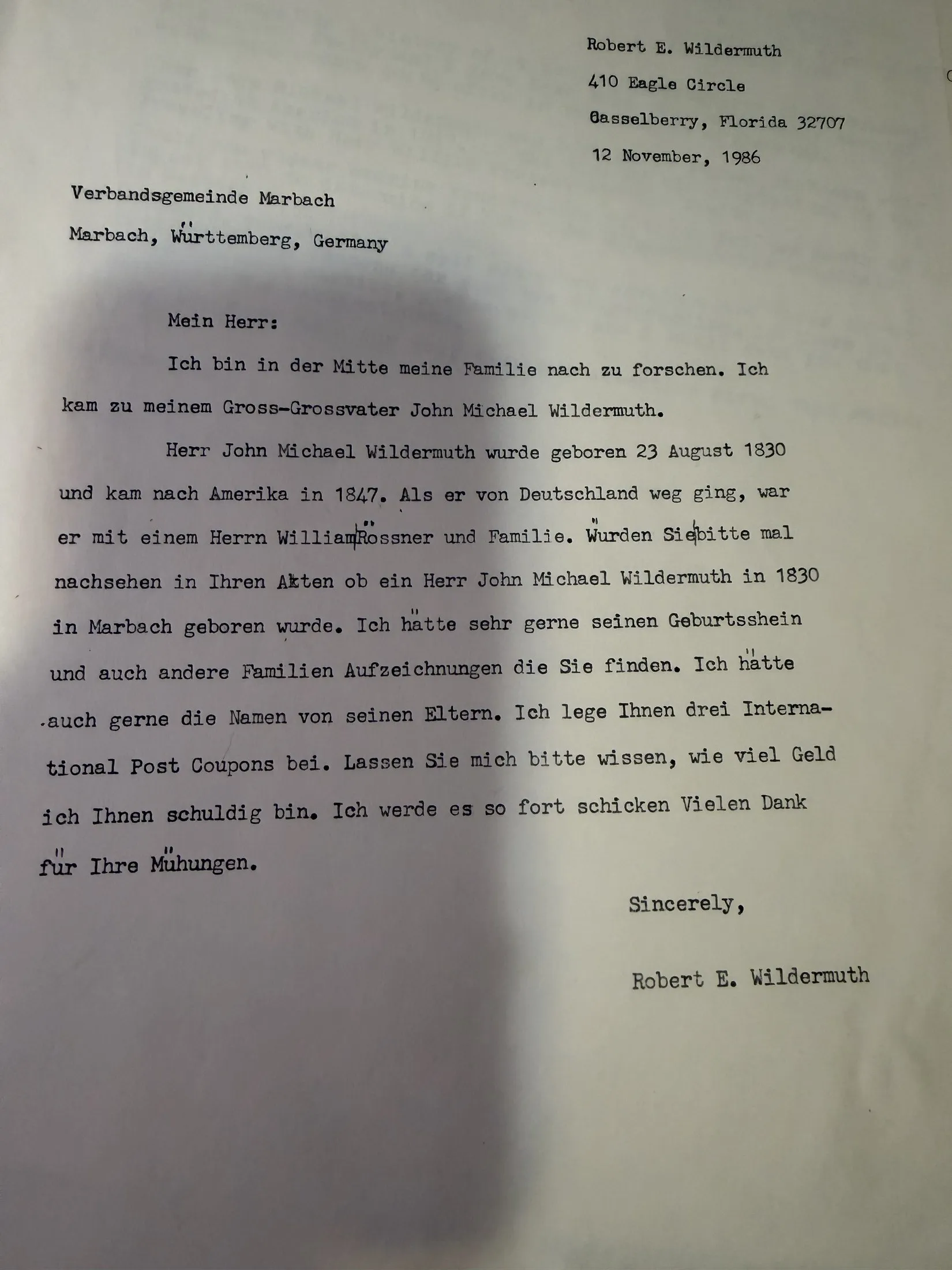 A typed letter in German dated 12 November 1986 to the Verbandsgemeinde Marbach, Württemberg, asking whether John Michael Wildermuth, born 23 August 1830, was born in Marbach, and requesting his birth certificate and the names of his parents.
