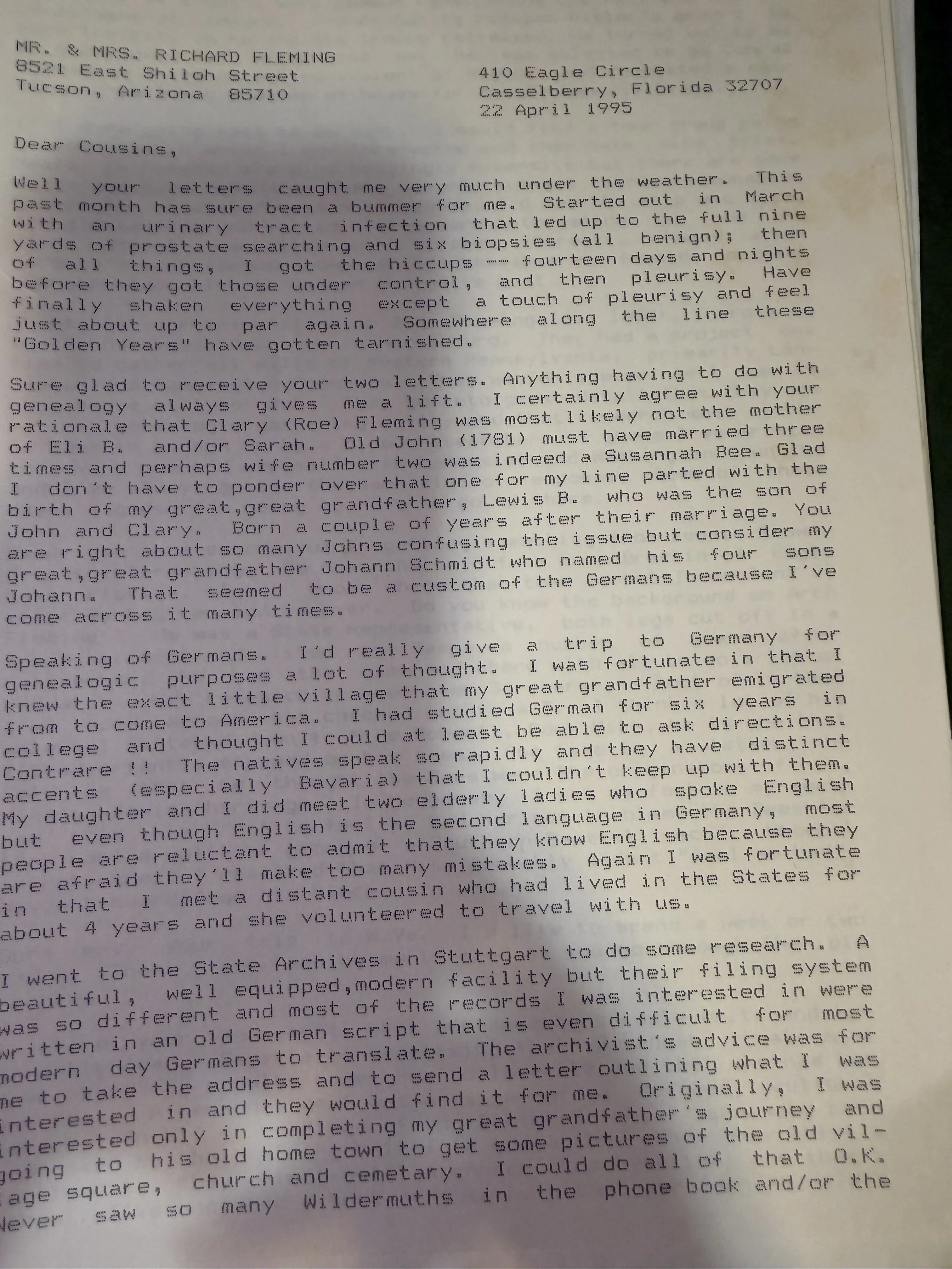 Page one of a typed letter dated 22 April 1995 from 410 Eagle Circle, Casselberry, Florida, addressed to Mr. and Mrs. Richard Fleming of East Shiloh Street, Tucson, opening Dear Cousins, describing a month of illness including six benign prostate biopsies, fourteen days of hiccups and pleurisy, agreeing that Clary Roe was probably not Eli’s mother, noting that his own line parted with the birth of Lewis, remarking that his great-great-grandfather Johann Schmidt named all four sons Johann, and then describing a genealogical trip to Germany and a research visit to the State Archives in Stuttgart.