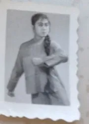 A second frame of the same young woman, a studio portrait, c. 1960s–70s.